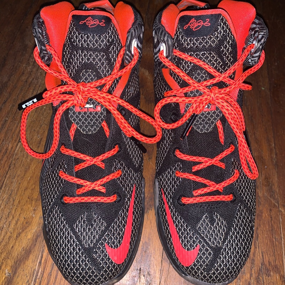Neon orange and black lebrons